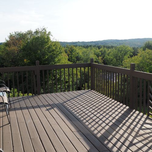 Overall:  the large deck with the surrounding hills in the background.