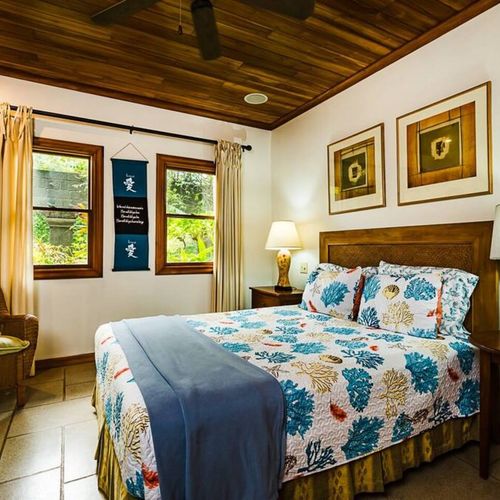 Guest bedroom with a queen size bed.