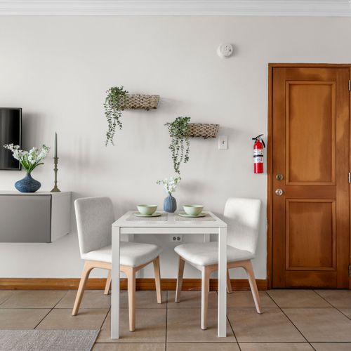 Charming dining nook for intimate meals. Perfect for morning coffee or a quick bite.