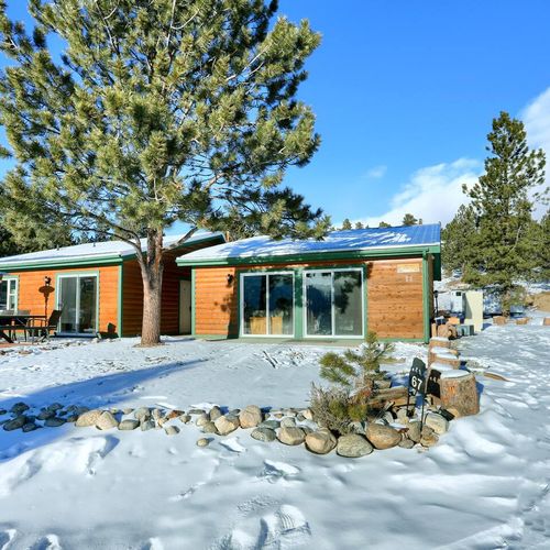 This cabin is convenient situated near the front yard space and driveway.