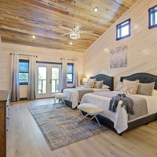 Upstairs double queen room with private balcony access.