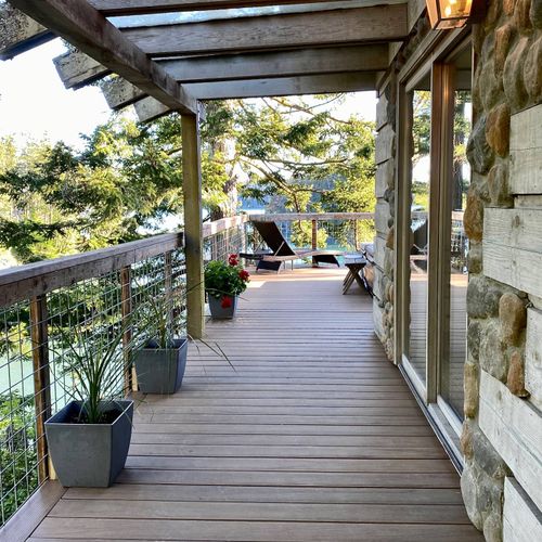 Wrap around deck leading from BBQ area to the outdoor spa