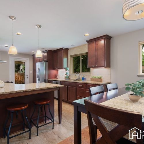 Experience the open concept design as the kitchen flows seamlessly into the dining area.