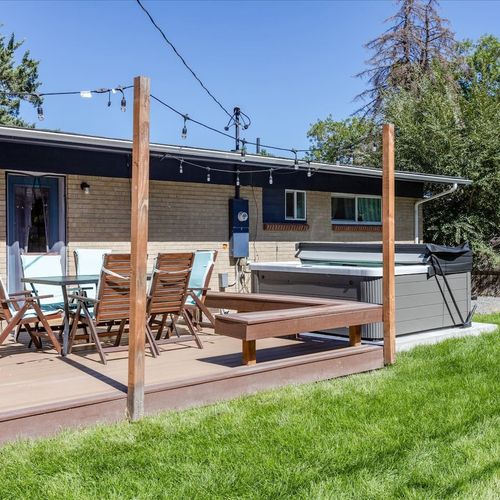- stylish backyard features a hot tub, outdoor dining area, and grassy space
- perfect for group hangs, bbq nights, or soaking under the stars
- functional layout with plenty of room to spread out and enjoy the outdoors