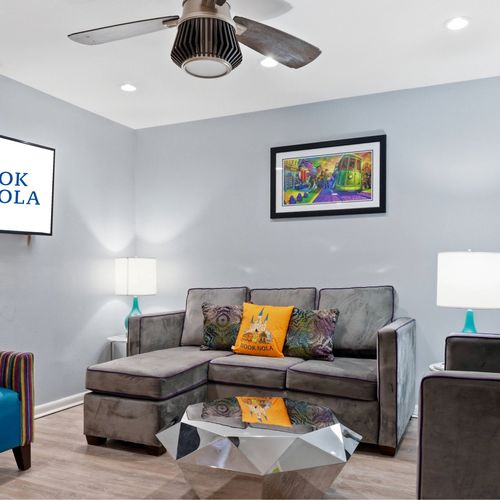 Cozy lounge nook w/ sectional sofa — ideal for movie nights in.
