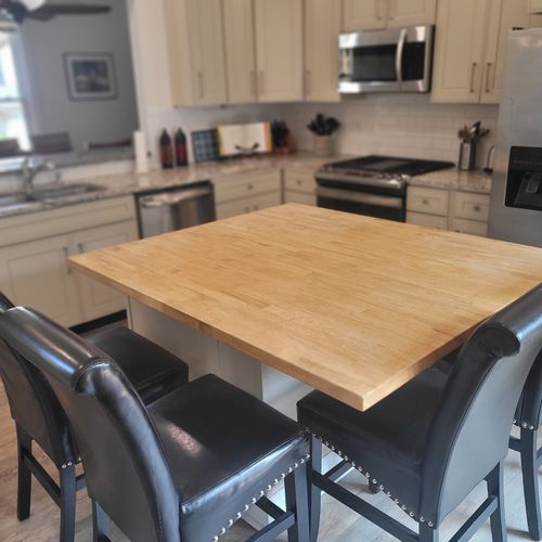 Kitchen:  the home has a newly-renovated kitchen with a large kitchen island and all appliances, including a dishwasher. There is also a good supply of cooking and dining utensils provided.