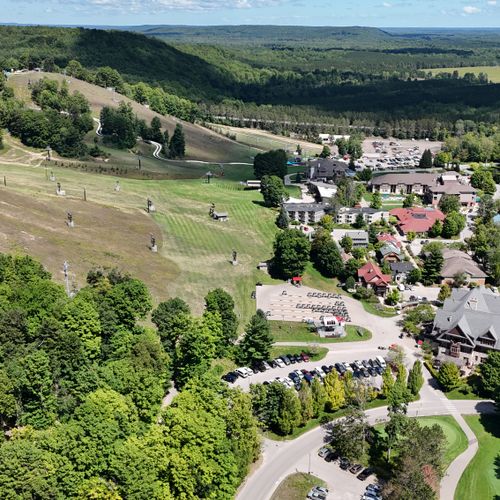 EXTERIOR:  A broad aerial view of Crystal Mountain showing the front ski slopes