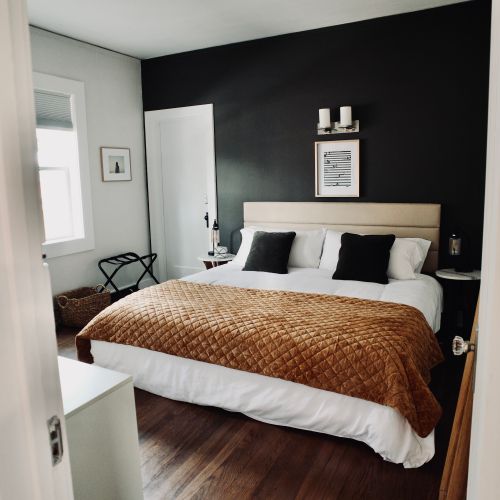 Organized and uncluttered king seize bedroom for a restful night.