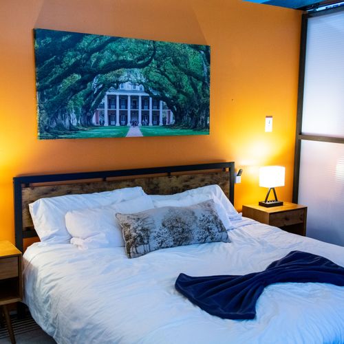 Rest easy in this warm, inviting bedroom w/ rich tones & New Orleans charm.