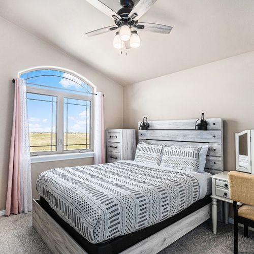 Sink into comfortable bedding, enjoy soft carpeting, and let sunlight gently fill the room.
