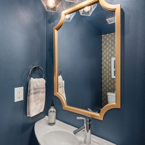 Well-kept half bathroom easily accessible from the main living space