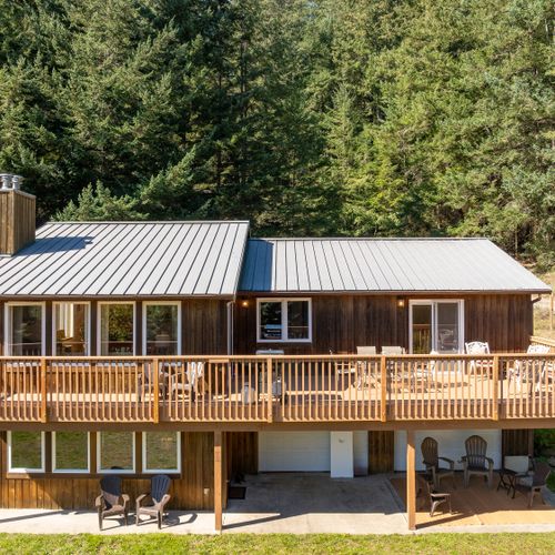 Both the entrance and lower patio lead either inside to the game room or to outdoor games like Corn Hole and Bocci provided..