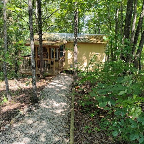 Exterior:  the front of the cabin in the summer. Note that "hillbilly-chic" design. ;-)