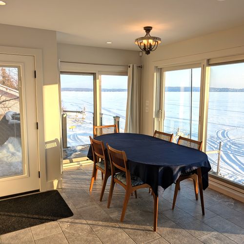 DINING AREA (MAIN FLOOR):  The home has a gorgeous dining area with a spectacular view of Crystal Lake!