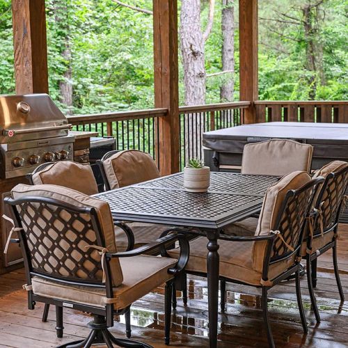 Outdoor dining table and gas grill.