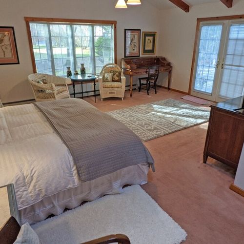 Bedroom #1 (first floor):  this bedroom has a long private entryway that opens up into an incredibly large bedroom with its own king size bed, television, library, sitting area, and private en suite bathroom.