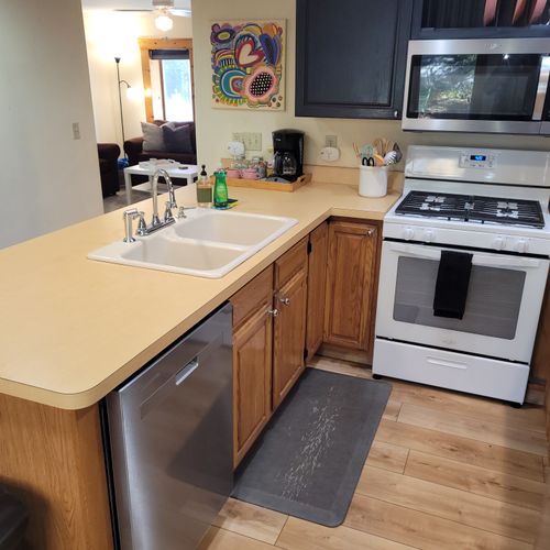 KITCHEN:  The home has a large and modern kitchen with all appliances (including a dishwasher) and a good supply of cooking and dining utensils.