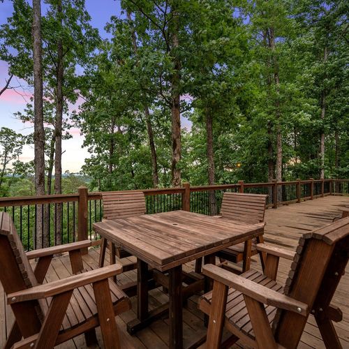 A table with 4 chairs for your outdoor dining experience.