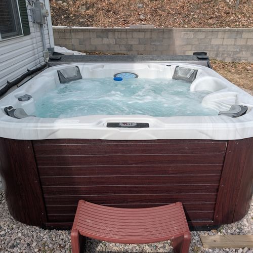 OVERVIEW:  The new hot tub on the east side of the home