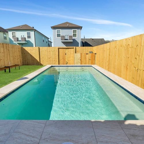 The fully-fenced pool from above — plenty of room to swim, splash & soak up the sun.
