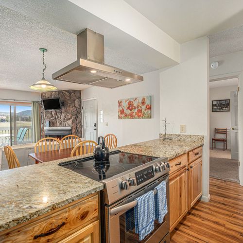 Granite countertops and modern appliances bring function and elegance to your cooking space.