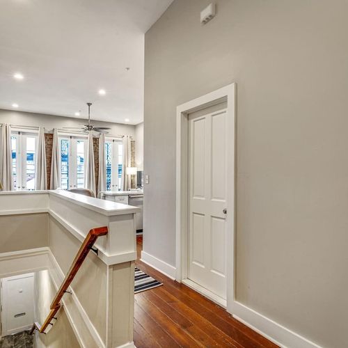 Airy entryway w/ tall windows & clean lines welcoming you into the home.