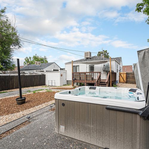 Step into relaxation in our newly installed hot tub, surrounded by a natural rock backdrop.