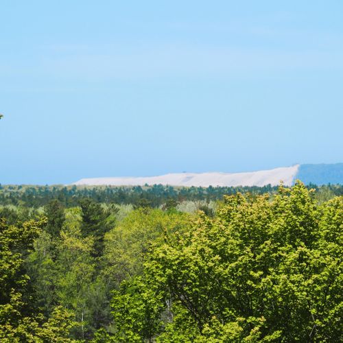 Exterior:  another view of sleeping bear dunes in the distance from the back of the house