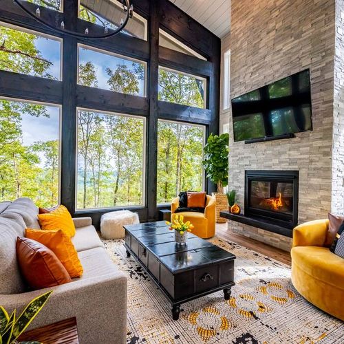 A cozy fireplace is at the heart of the living room.
