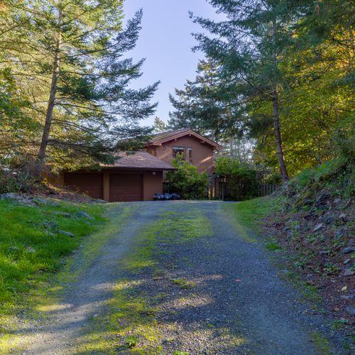With five acres of waterfront forest and a long, private driveway, you have solitude and peace at the end of the road.