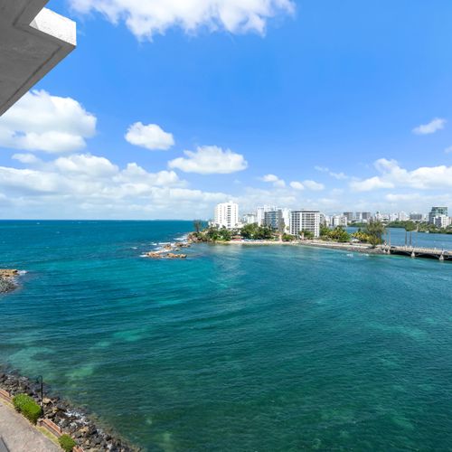 Witness the charm of the city's infrastructure blending seamlessly with the natural beauty of the waterfront, an iconic scene right from your window.