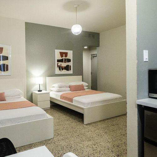 Settle into a peaceful night's sleep in this tranquil bedroom. The soft lighting and comfortable bedding are perfect for unwinding and recharging.