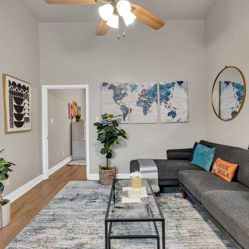 Bright, airy living space w/ a world map accent & plenty of room to unwind.