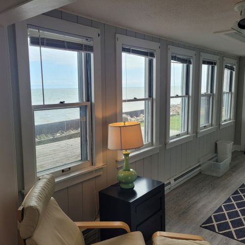 Beach house - living room:  not very large, but comfy with incredible views of lake huron! Great for reading and relaxing!