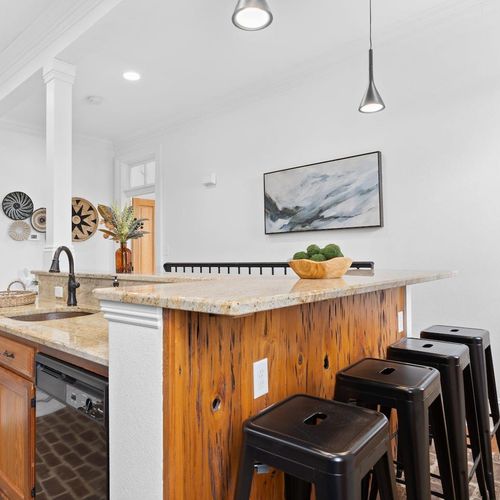 Bar seating & dining area — a great spot to share a meal or morning coffee.
