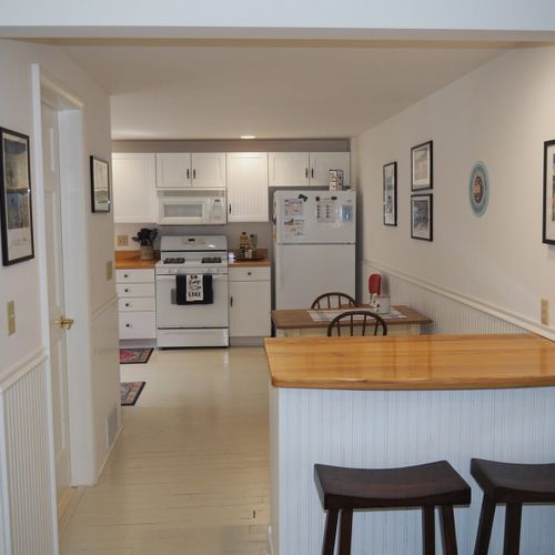 Kitchen:  looking into the kitchen from the living room. The door to the common bathroom for the first floor is also at the left of the photo.