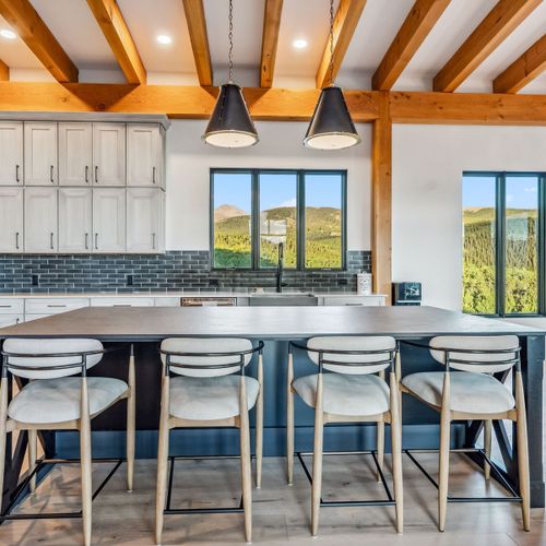 Stylish dining area perfect for gatherings, illuminated by natural light.