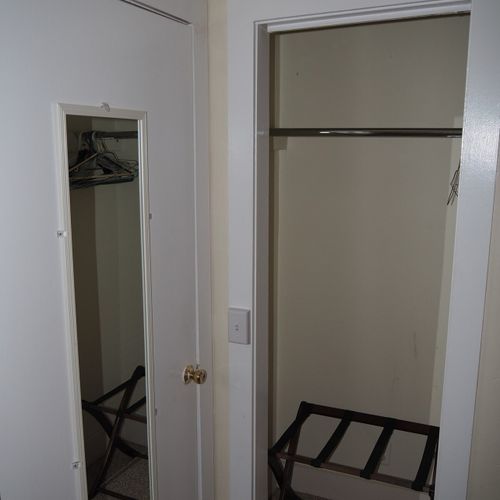 Bedroom #2:  features two twin beds, a nightstand, lamp, dresser, mirror, and closet.