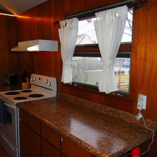 Kitchen:  very convenient and functional galley kitchen with all appliances, including a dishwasher. Includes lots of counter space and a good supply of cooking and dining utensils.