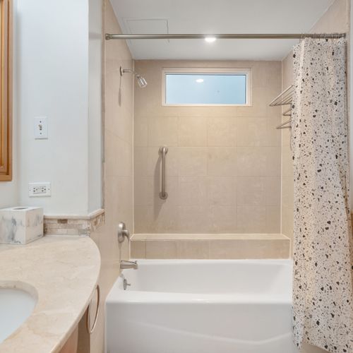 Your private oasis! This bathroom offers a tranquil setting for a refreshing shower or a relaxing soak.