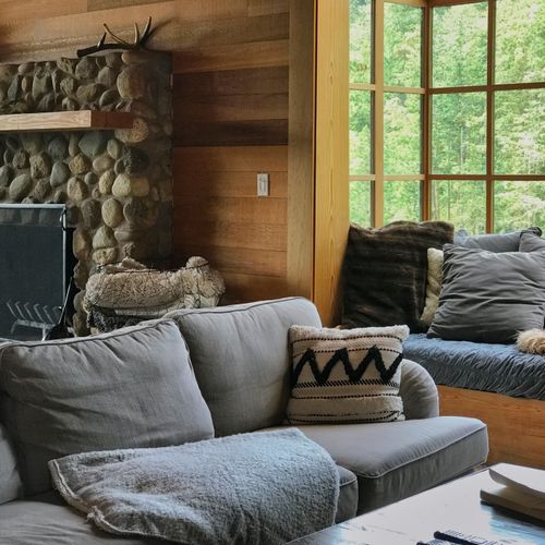 Cozy seating by the fire while watching movies on the Samsung 70" Smart TV.