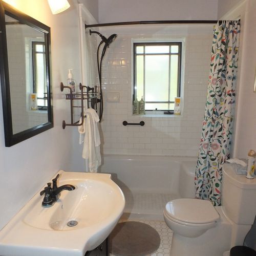 Bathroom #1 (first floor):  this is the main floor bathroom. It's a full bathroom that has been beautifully renovated and redecorated!