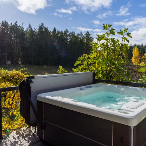 Four person hot tub overlooking the fields