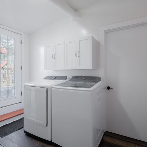 Laundry area near the back door has a washer and dryer.