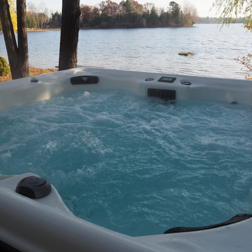 Overview:  the new year-round hot tub with bass lake and the private lakefront in the background