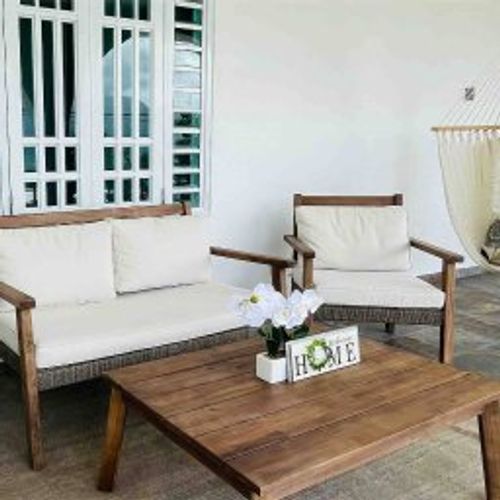 Unwind in style! Our spacious outdoor terrace, complete with a comfy sofa, additional seating, a relaxing hammock, and a convenient table, is your private oasis for relaxation and al fresco dining.