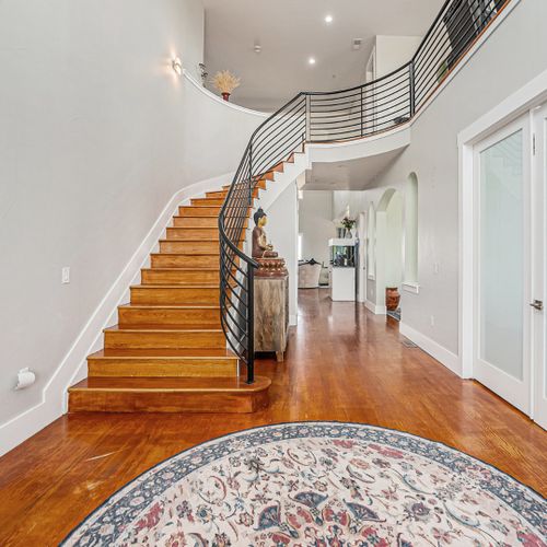 Polished, open spaces are warmed by rich wood elements and airy layouts.