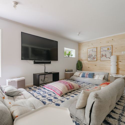 The bunkroom includes a cozy living space with smart tv!