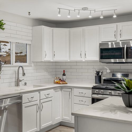 The kitchen has everything you need: cookware, utensils, and modern appliances all ready for you to prepare any meal!