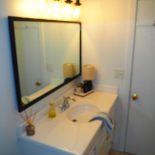 Bathroom #1:  full bathroom with a combination tub & shower.